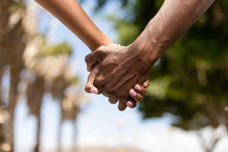 Close up outdoor protrait of black african american couple holdi